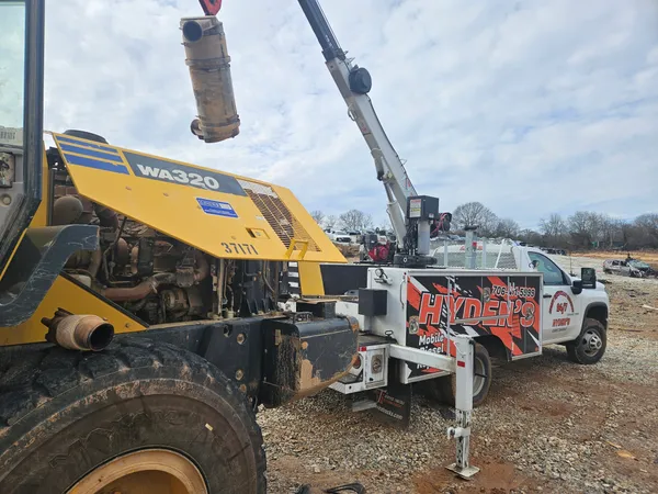 Loader bucket repair at a customer job site